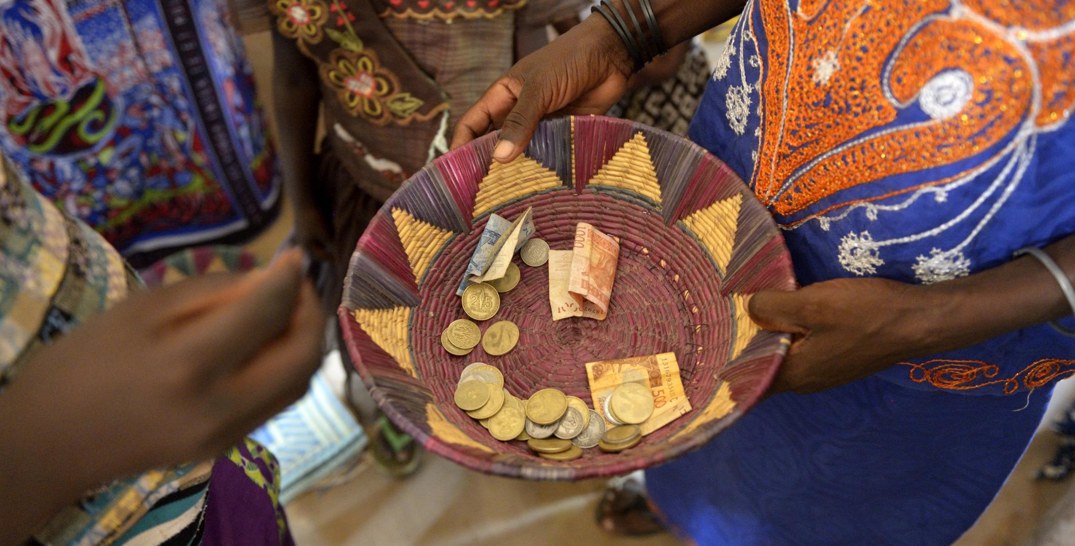 Money collection from the community in a basket